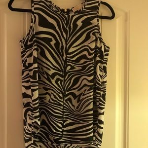 Black and white sleeveless top.